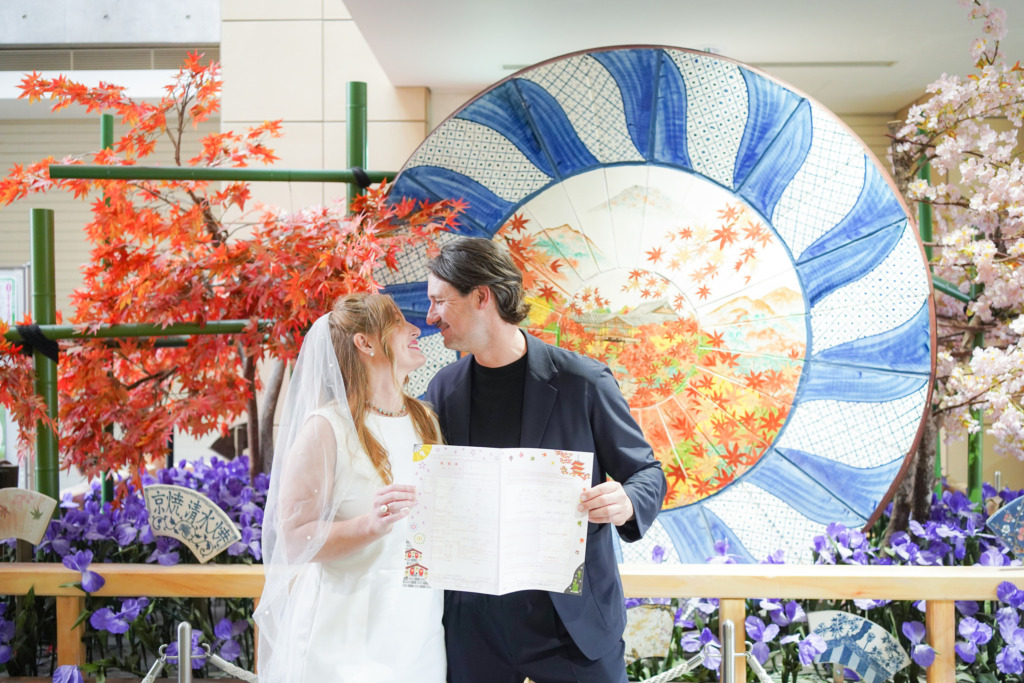 Couple with their marriage certificate in a kyoto pre wedding photoshoot