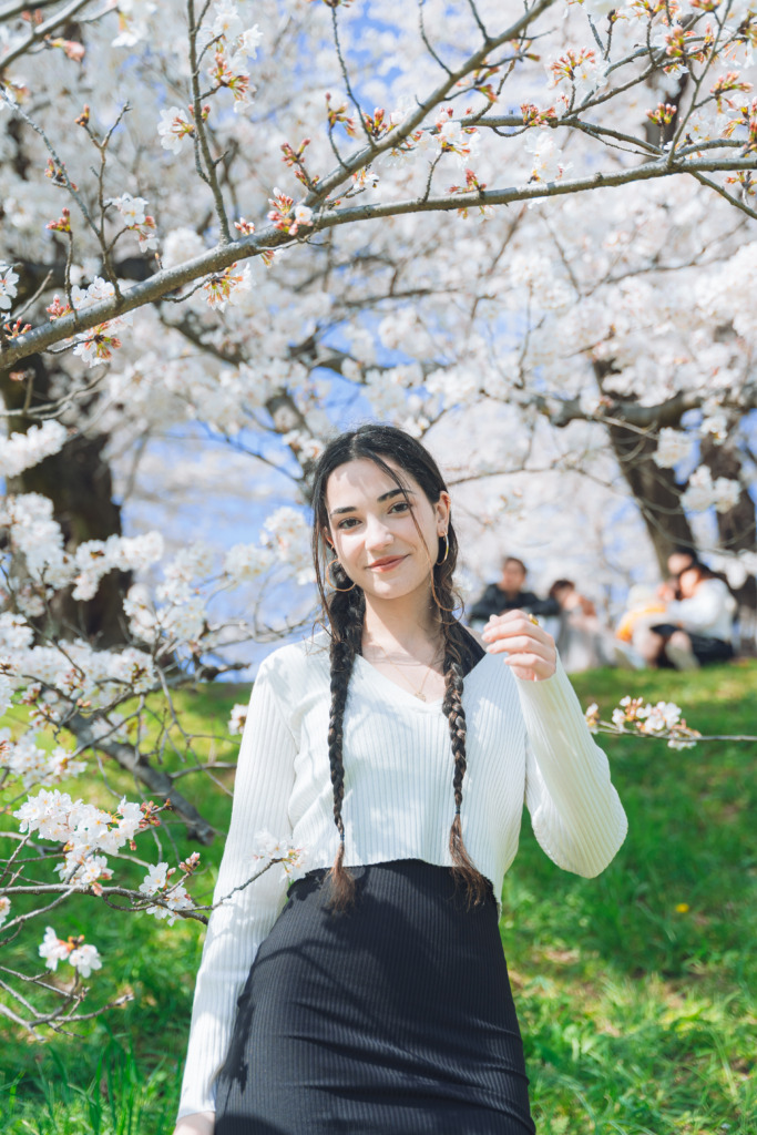 Spring portrait photoshoot of girl among sakuras in Kyoto Japan
