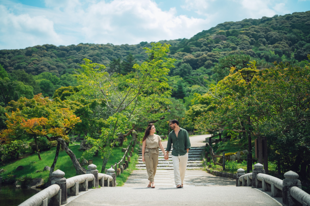 Couple going for a leisurely stroll during a kyoto photoshoot in the Maruyama Park, in Kyoto, Japan